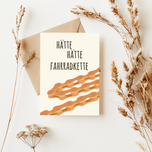 Lade das Bild in den Galerie-Viewer, Postkarte mit lustigem Spruch hätte hätte Fahrradkette in beige und orange