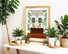Lade das Bild in den Galerie-Viewer, Poster einer Illustration einer gemütlichen Terrasse mit rotem Holzboden und botanischen Details zum Entspannen