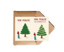 Lade das Bild in den Galerie-Viewer, moderne Weihnachtskarte mit schwarzem Humor im Meme Stil, die vermittelt, dass Probleme auch an Weihnachten bestehen bleiben und nur kaschiert werden