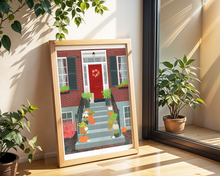 Lade das Bild in den Galerie-Viewer, Urbaner Kunstdruck mit Illustration eines Hauseinganges mit Treppen vor dem Haus. An der roten Tür hängt einherbstlicher Kranz und Kürbisse und Pflanzen schmücken die Treppen zu dem Backsteingebäude.
