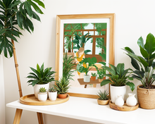 Lade das Bild in den Galerie-Viewer, Dekoration Indoor Gardening mit Poster einer Frau inmitten verschiedener Pflanzen
