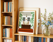 Lade das Bild in den Galerie-Viewer, Kunstdruck Herbst mit Illustration einer Terrasse vor einer Häuserfassade mit gemütlichen Schaukelstühlen und Pflanzen
