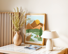 Lade das Bild in den Galerie-Viewer, Tischdekoration mit handgemaltem Naturposter in natürlichen Farben und dem Wort Wanderlust
