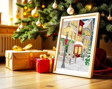 Lade das Bild in den Galerie-Viewer, festliches Poster neben Geschenken unter dem Weihnachtsbaum. Das Poster zeigt Häuser, die üppig weihnachtlich dekoriert und beleuchtet sind.
