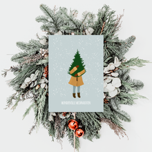 Lade das Bild in den Galerie-Viewer, Geschenke verpacken mit der besonderen Weihnachtskarte in blau mit Mädchen, das eine Tanne trägt und Schriftzug wundervolle Weihnachten
